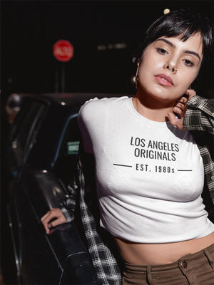 Latina female wearing a Los Angeles Originals white unisex tshirt.
